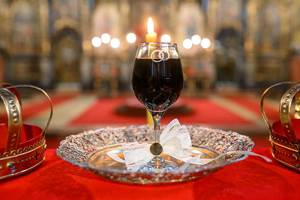 Two crowns, a cup of wine and a cross prepared for baptism