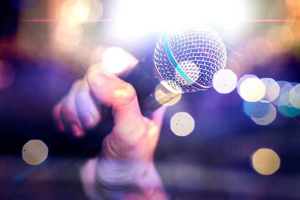 istock Microphone and stage lights.Concert and music concept 2249537340