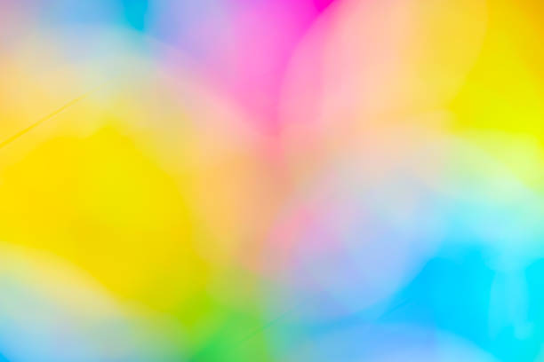 Vibrant abstract colorful background with soft blurred gradient texture. Bright yellow, pink, and blue bokeh light effect perfect for wallpaper, creative design, and festive holiday backdrop.