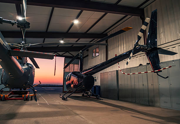 istock Helicopters parked in a hangar at sunset. 2249539245