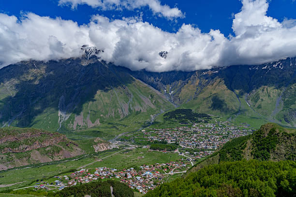 istock Kazbegi town beneath dramatic Caucasus mountains and low clouds 2249539987