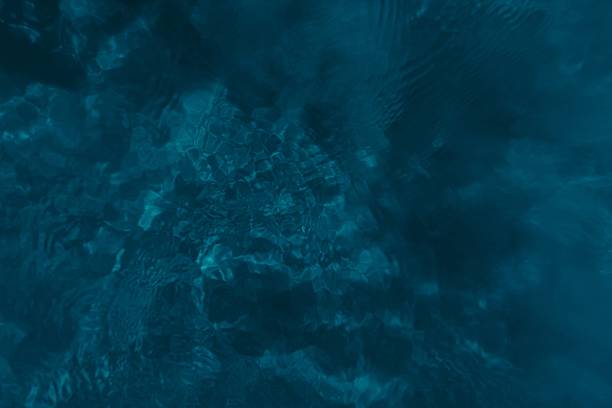 istock abstract blue water on sand sea bottom, top view 2249540836