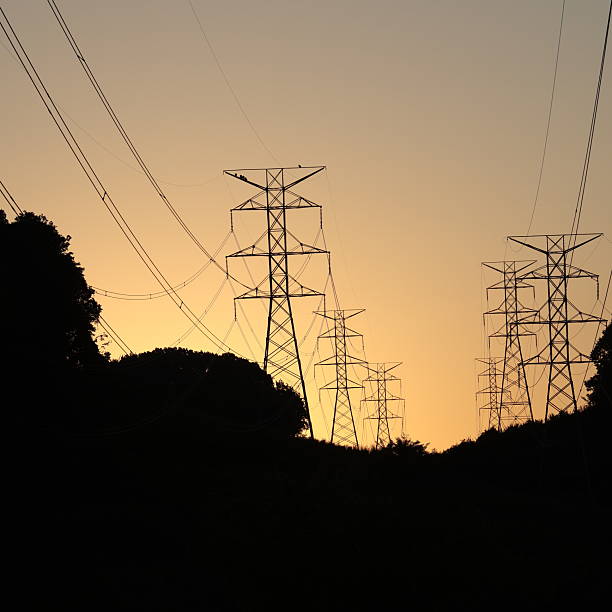 istock Transmission Towers At Dawn 2249541102