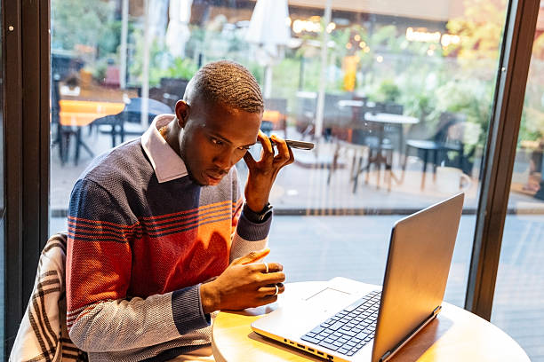 istock Focused individual working on a laptop inside a cozy cafe during a quiet afternoon 2249541446
