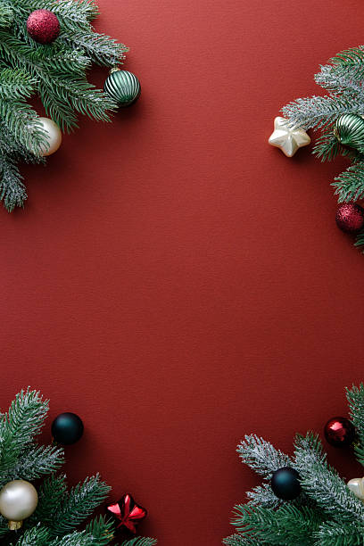 istock Elegant Red Christmas background with fir branches and baubles. 2249542549