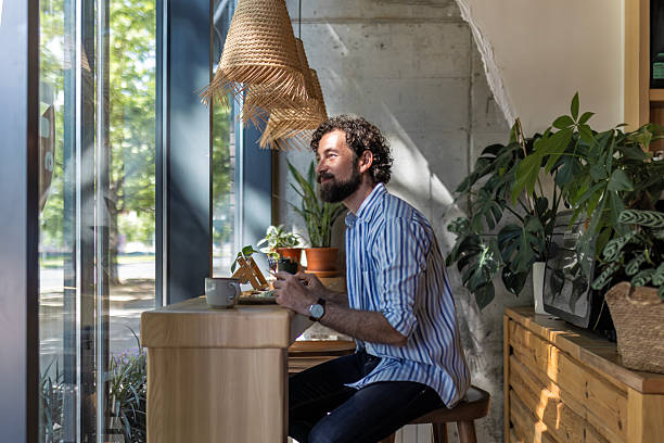 istock Joyful Young Man Savoring His Lunch Indoors 2249542774