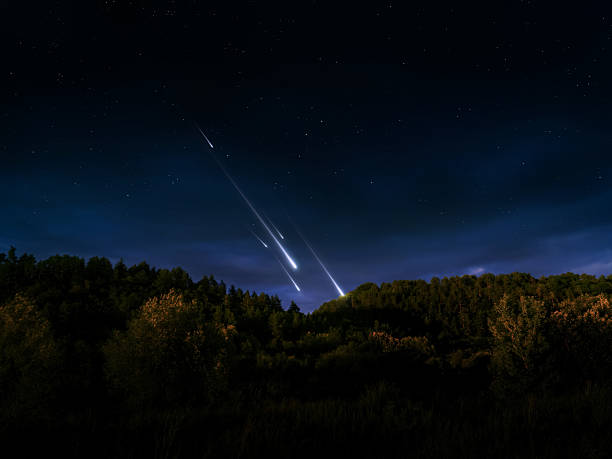 istock Meteors illuminated the evening sky. Bright meteor trail over the hill. 2249542890