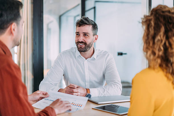 istock Group of business persons talking in the office. 2249543801