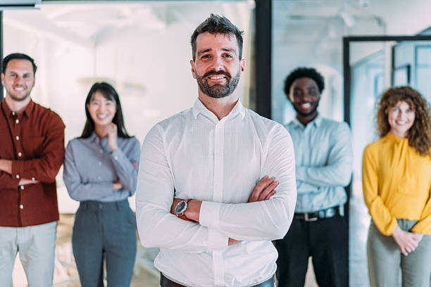 istock Confident businessman and his team. 2249543829
