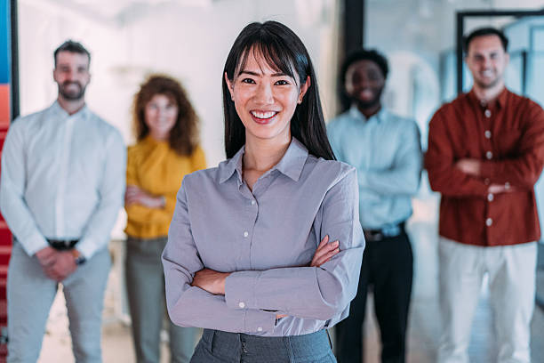 istock Confident businesswoman and her team. 2249543830