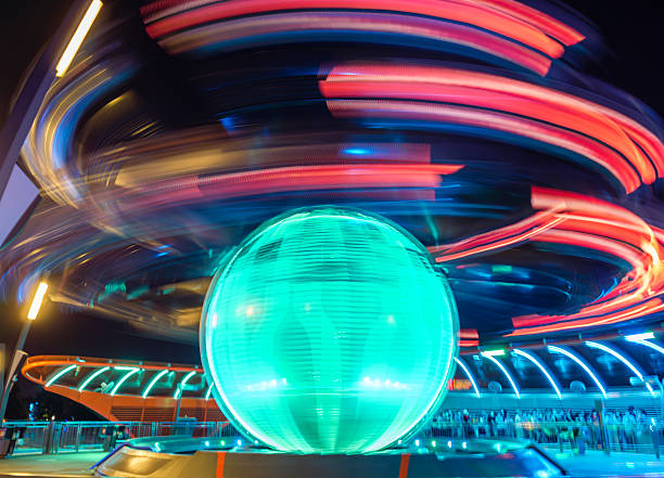 Spectacular ride at an autumn fair, with the so called Breakdancer at the Schelmenmarkt an autumn fair in downtown Gelnhausen, Hesse, Germany. The ride with the Breakdancer is in full motion, rotating and gyrating in two directions. Breathtaking speed combined with cool music and a laser light show.