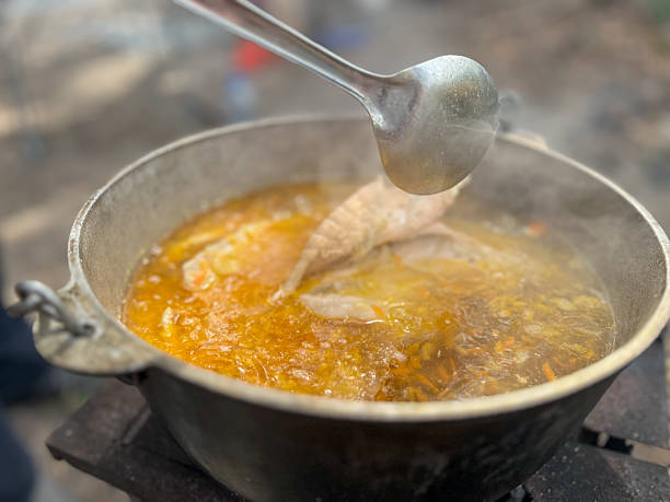 istock Cooking traditional fish soup in outdoor cauldron 2249544903