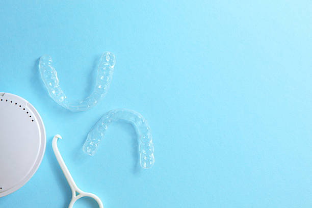 istock Aligners for straightening teeth on a blue background 2249545051