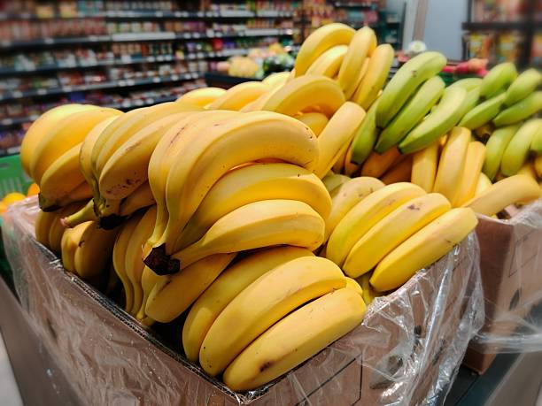 istock Fresh Yellow Bananas Display in Grocery Store 2249547342