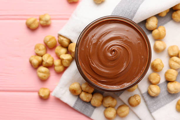 chocolate paste with a bowl on a table.