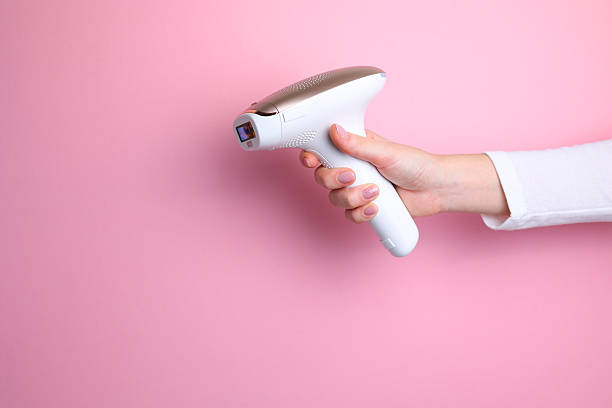 istock Modern home photoepilator on a colored background. Remove unwanted hair. 2249551609