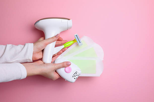 istock Modern home photoepilator on a colored background. Remove unwanted hair. 2249551650