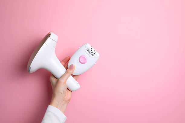 istock Modern home photoepilator on a colored background. Remove unwanted hair. 2249551651