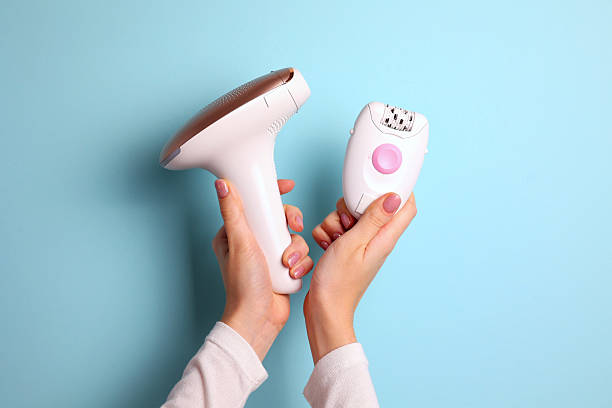 istock Modern home photoepilator on a colored background. Remove unwanted hair. 2249551693