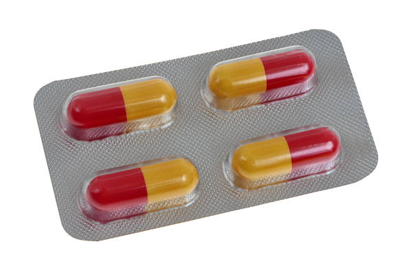 Yellow capsule on white background