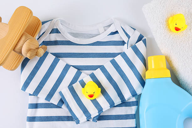 istock Laundry detergents for children's clothes and children's clothes 2249554383