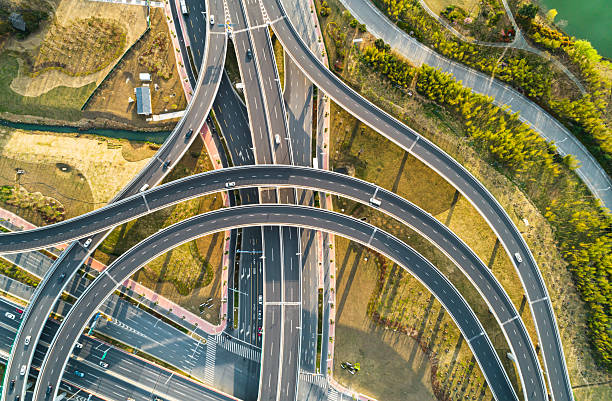 istock Aerial view of complex highway interchange surrounding lush greenery in daylight 2249555985
