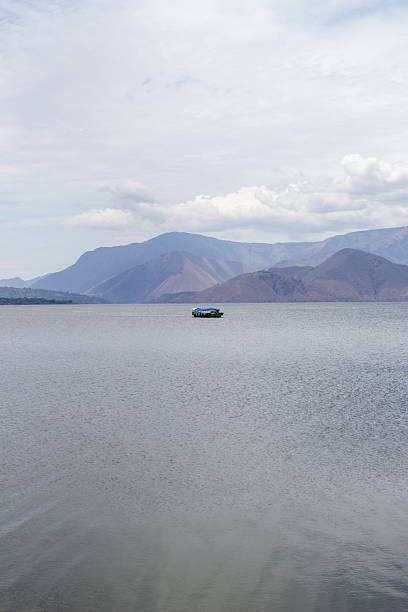 istock boat sailing on lake toba 2249558309