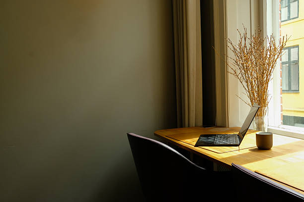 istock Minimalist Home Office Workspace with Laptop by Sunlit Window 2249561739
