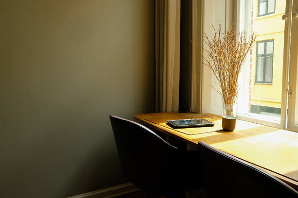 istock Minimalist Home Office Workspace with Laptop by Sunlit Window 2249561807