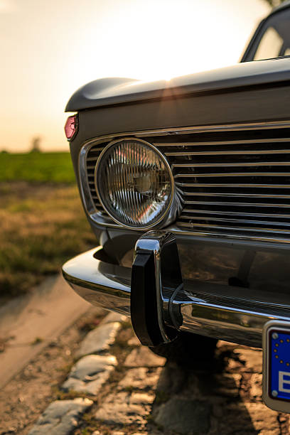 istock Vintage Car Headlight and Chrome Bumper at Sunset 2249562639