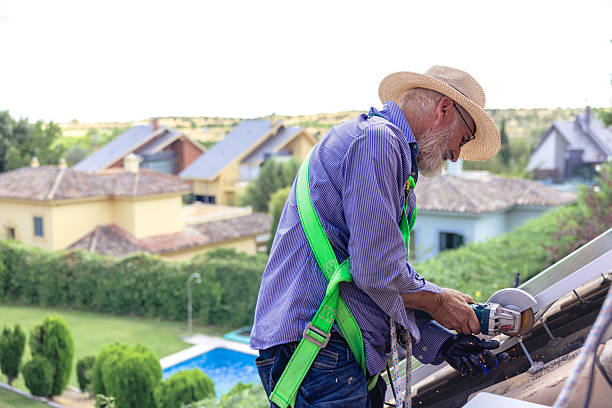 istock Mature adult worker installing solar panels on rooftop 2249563148