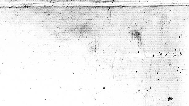 Monochrome grunge texture with scratches, paint splashes, and halftones showcasing elements of wear and age in a horizontal format.