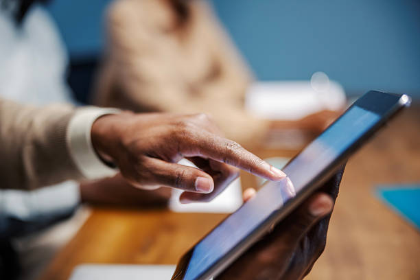 istock Person using digital tablet during business meeting 2249566794