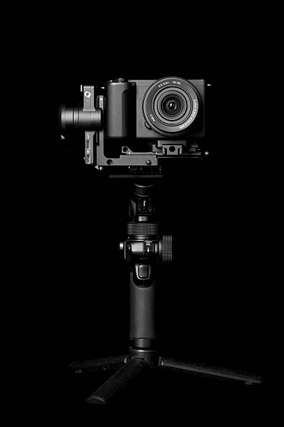 istock Steadycam or stabilizer with a camera on black background. Equipment for the videographer. 2249567267