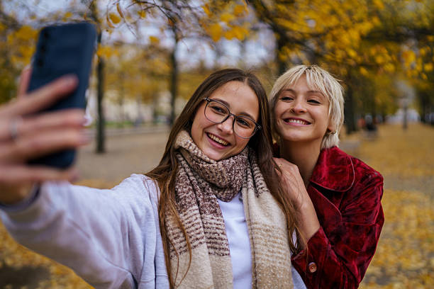 istock Two Friends Taking a Selfie on an Autumn Day 2249568657