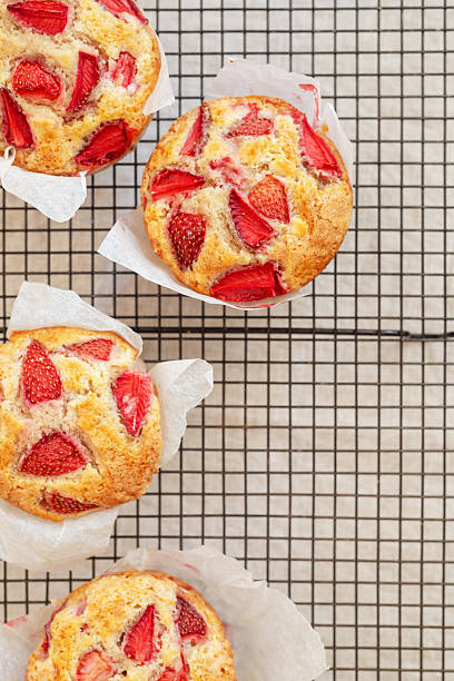 istock homemade strawberry muffins place on a cooling rack. 2249568716