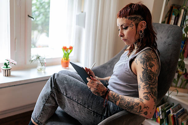 istock Tattoo Artist Working on a Digital Illustration at Home 2249569308