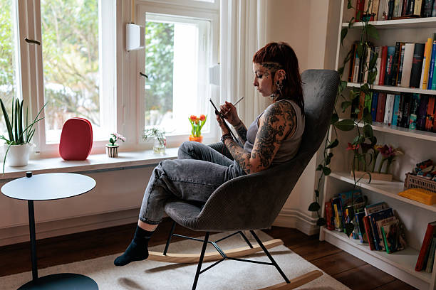 istock Tattoo Artist Working on a Digital Illustration at Home 2249569367