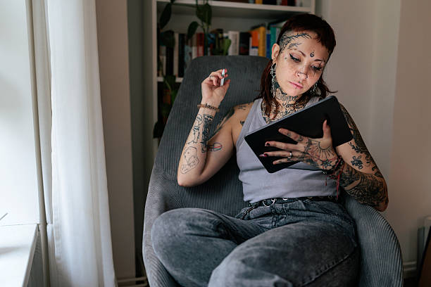 istock Tattoo Artist Working on a Digital Illustration at Home 2249569559