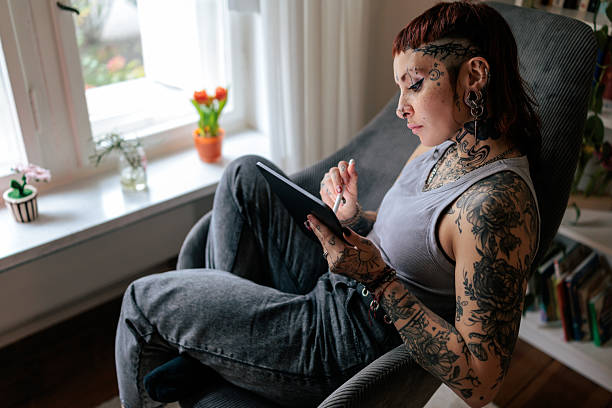 istock Tattoo Artist Working on a Digital Illustration at Home 2249570101
