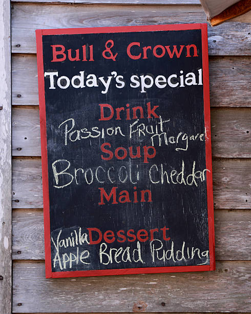 A rustic chalkboard menu displays the daily specials at a restaurant, including drinks, soup, and dessert options