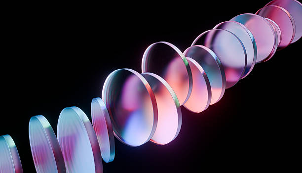 istock Series of colorful, translucent discs arranged in spiral pattern against dark background, creating futuristic and abstract visual effect 2249573039