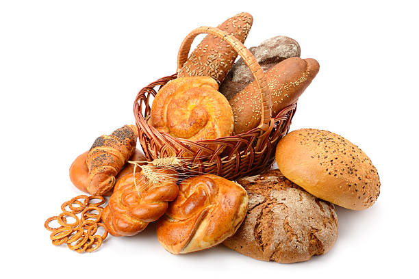 istock Assorted Fresh Bread and Pastries in a Rustic Basket on White Background 2249573464