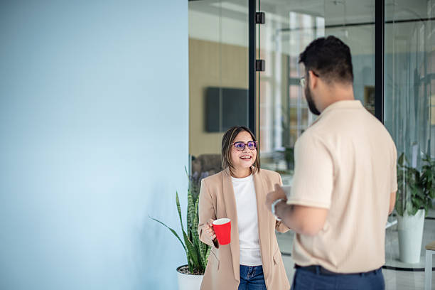 istock Coworkers engaging in conversation during a casual meeting in a modern office setting 2249576853