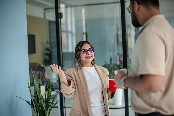 istock Engaged conversation between coworkers in a modern office environment 2249577377