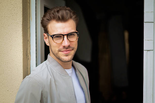istock Portrait of a handsome young man standing by the window 2249577978