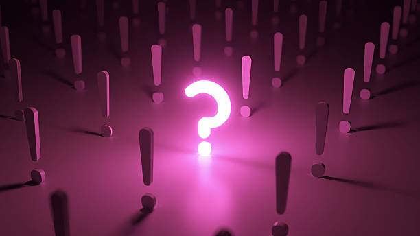 istock Glowing purple question mark standing out in a crowd of exclamation points on a dark background, representing the concept of doubt, curiosity, and the search for answers and solutions 2249578197