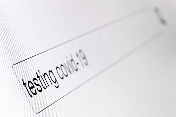 istock Search bar on a computer monitor with the question Testing covid-19. Searching for information on the Internet, close up. 2249580006