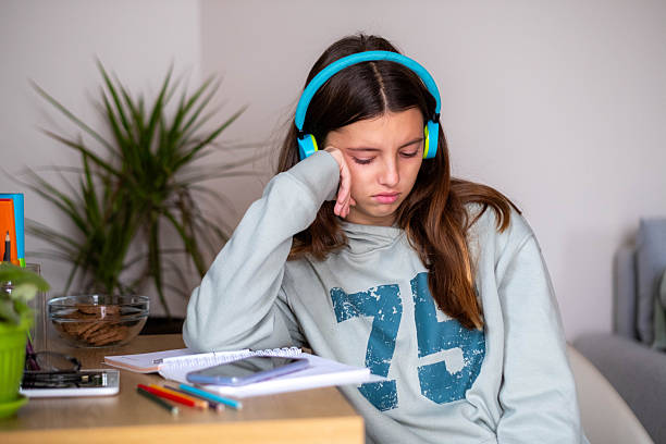 istock Teenager girl crying feeling sad while studying at home 2249580599