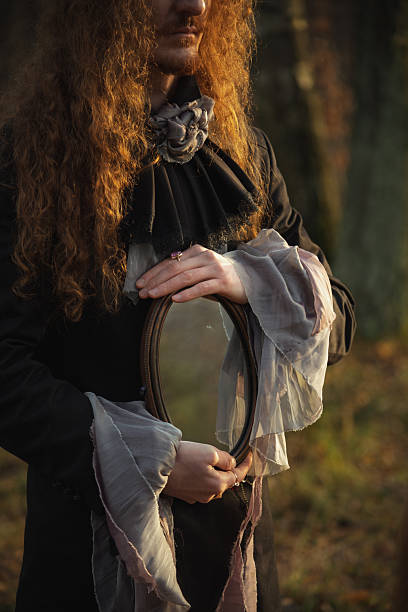 istock Reflective moment in a forest setting with a figure holding a mirror 2249581844